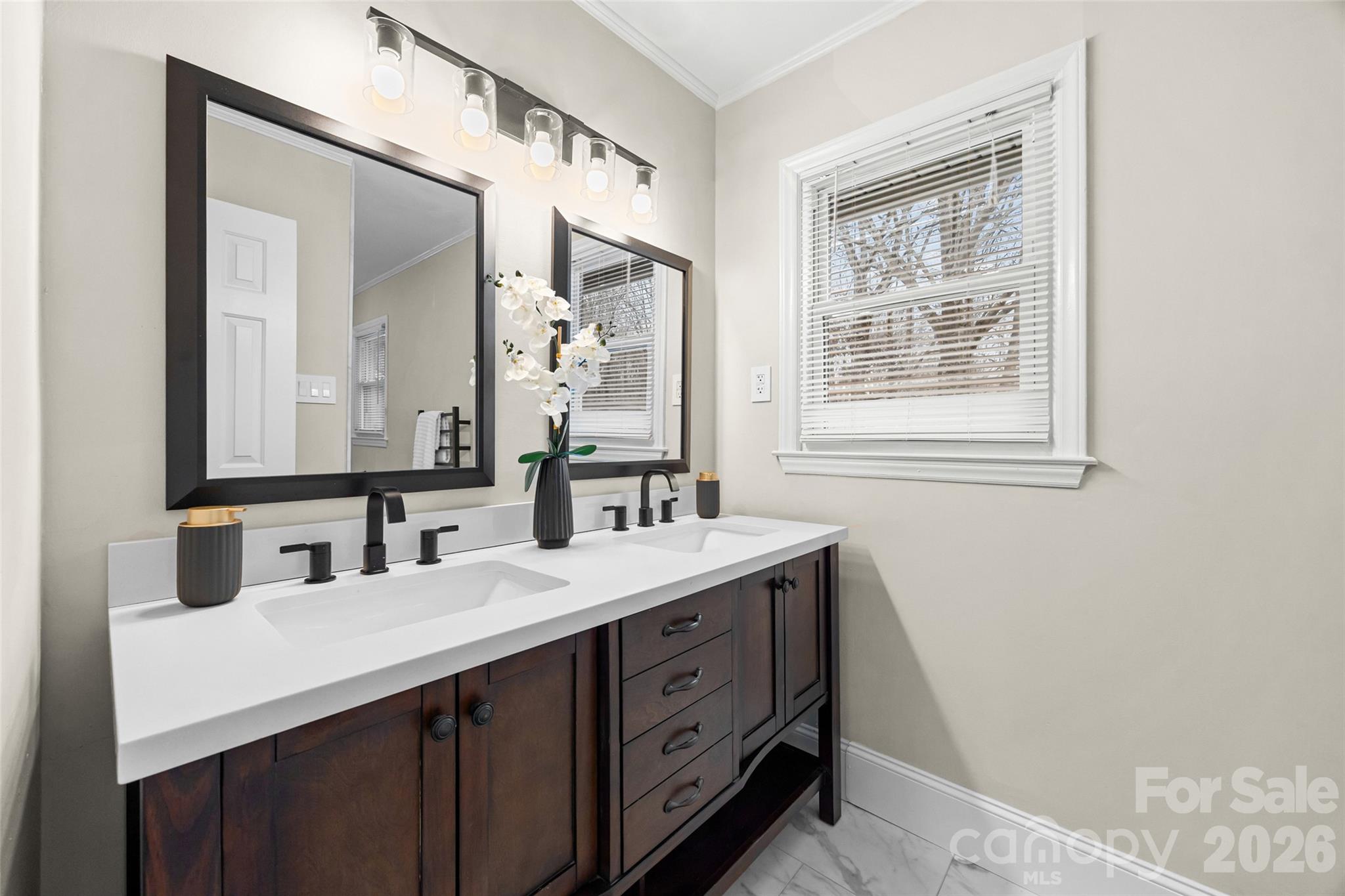 3320 Tilley Morris Road Matthews, NC 28105 - Photo 32 of 48 a bathroom with a double vanity sink and mirror