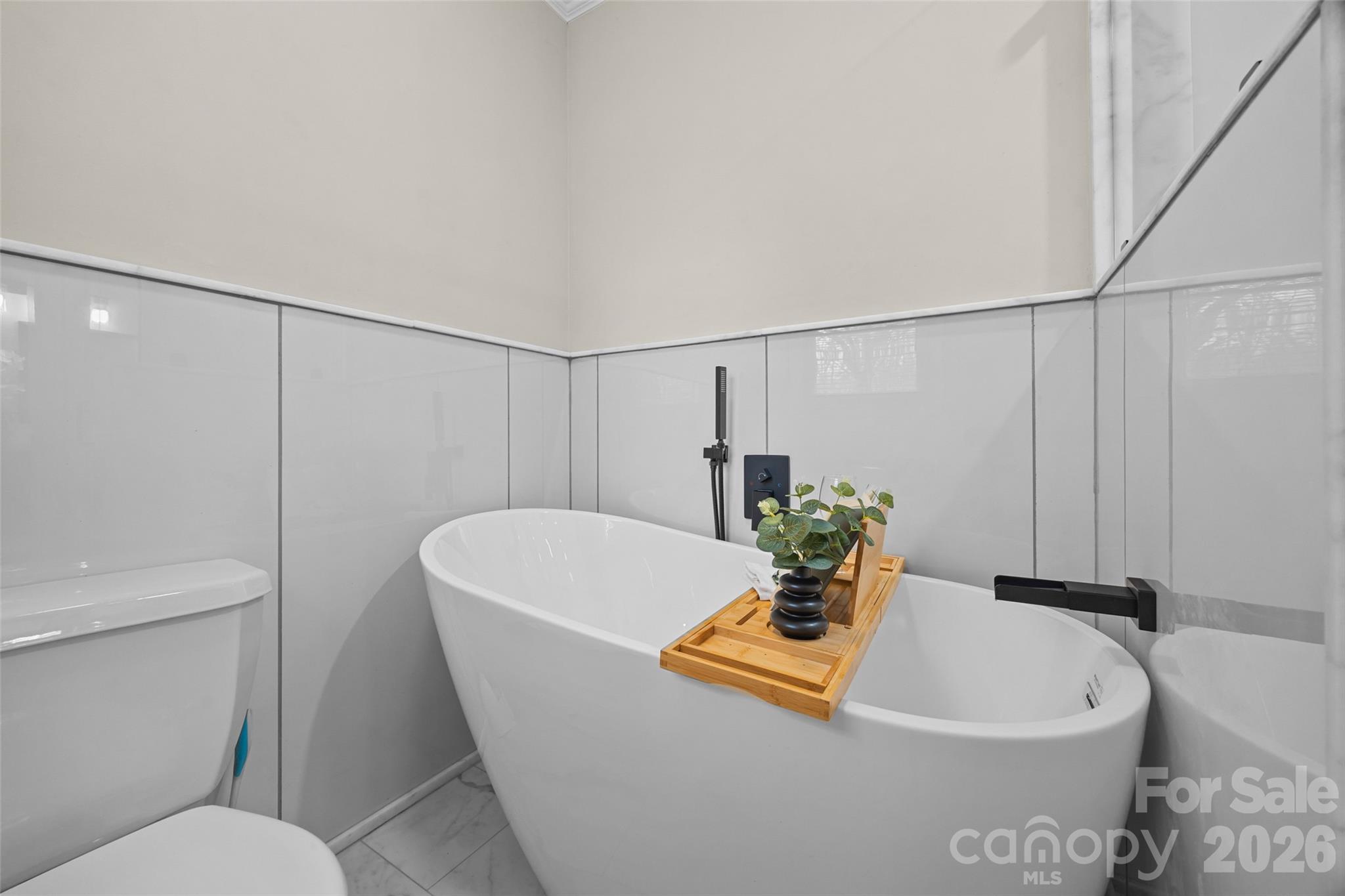 3320 Tilley Morris Road Matthews, NC 28105 - Photo 33 of 48 a bathroom with a sink a toilet and bathtub