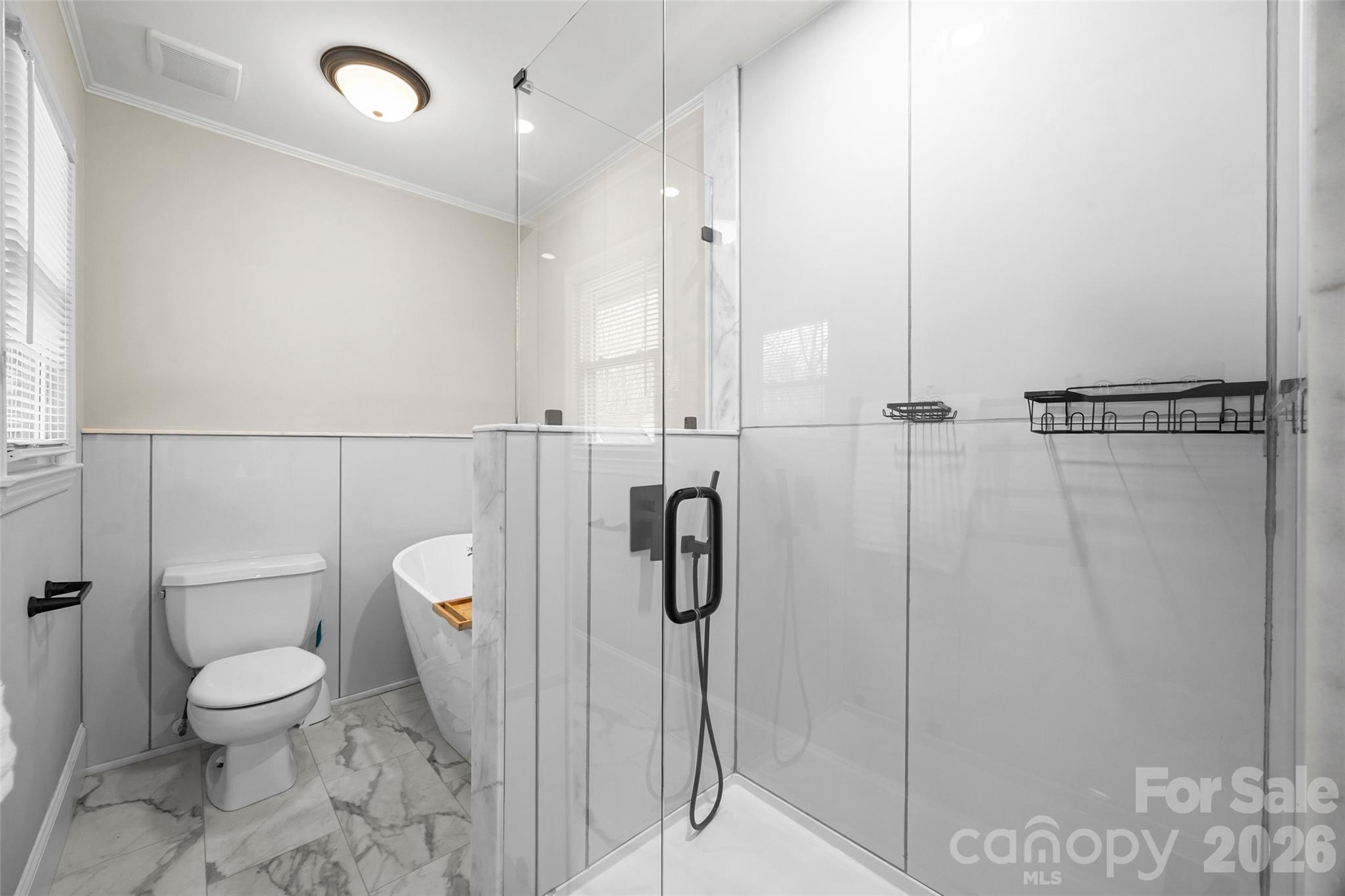 3320 Tilley Morris Road Matthews, NC 28105 - Photo 34 of 48 a bathroom with a toilet a sink and shower