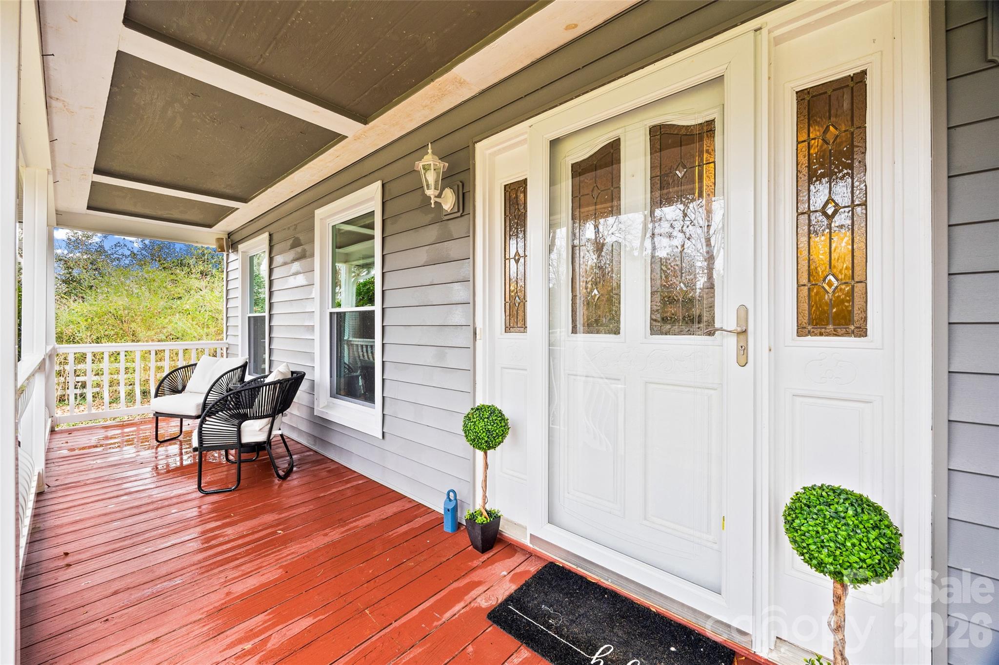 3320 Tilley Morris Road Matthews, NC 28105 - Photo 36 of 48 a view of a balcony with chair and wooden floor