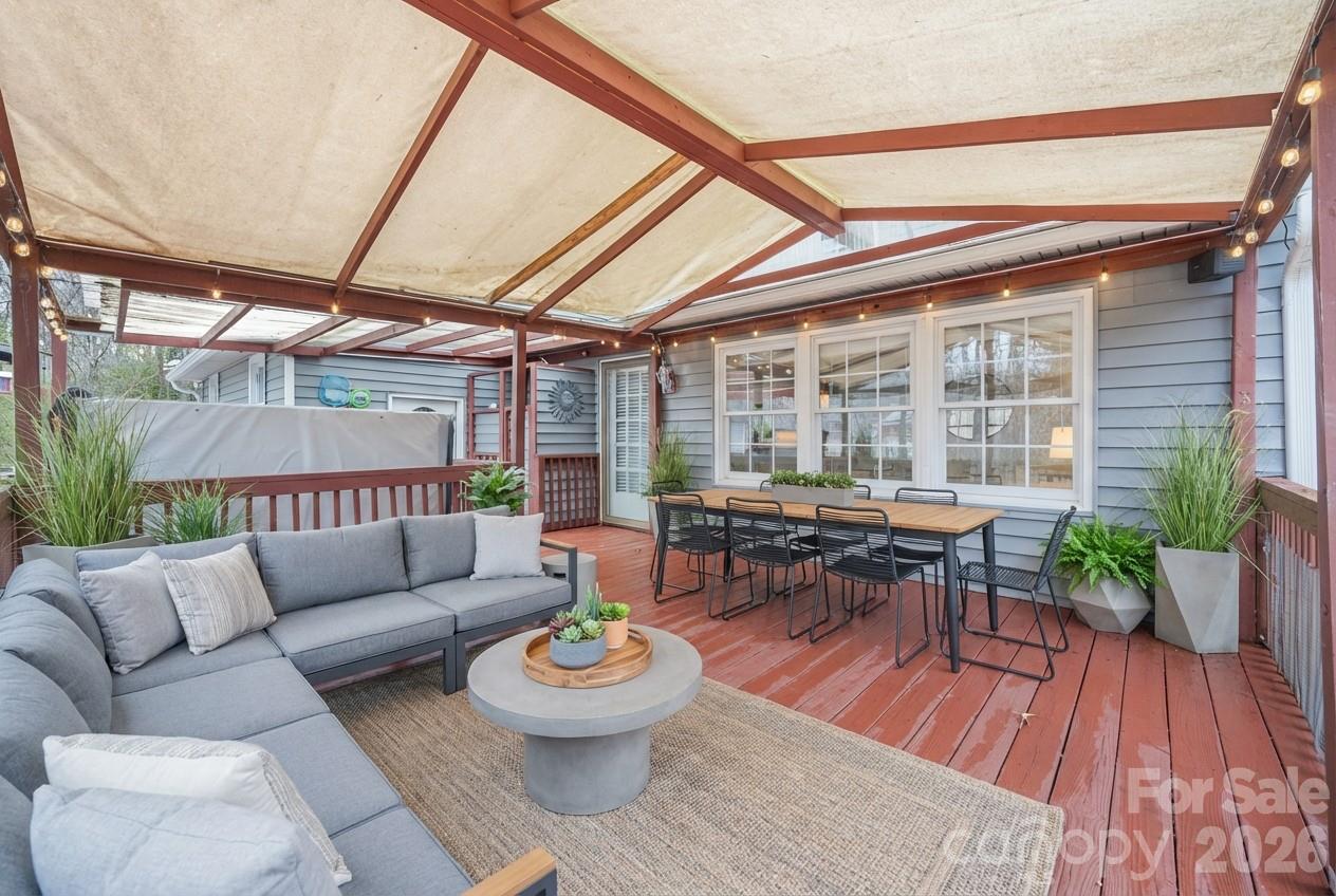 3320 Tilley Morris Road Matthews, NC 28105 - Photo 38 of 48 a living room with patio furniture and a wooden floor