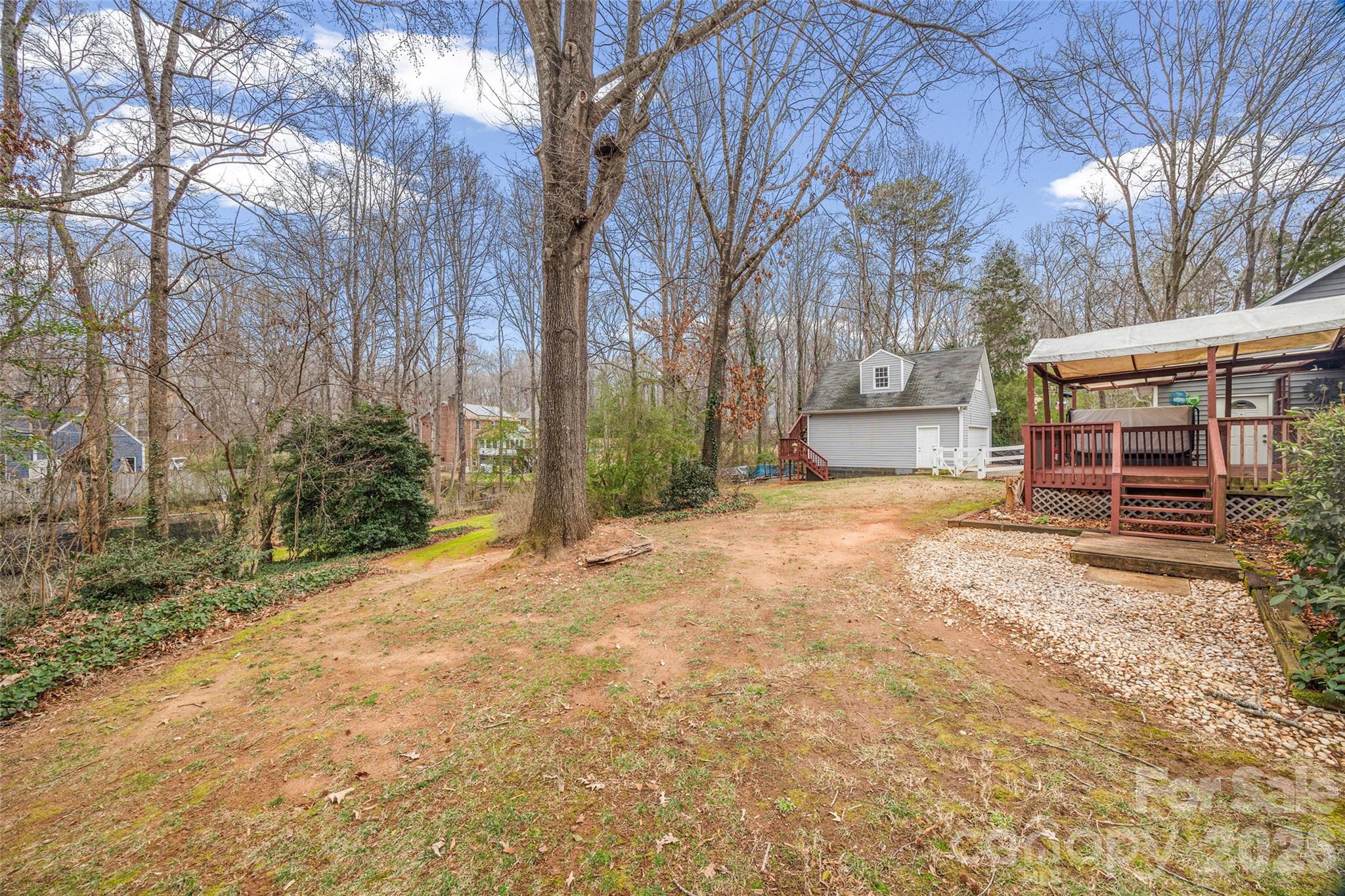 3320 Tilley Morris Road Matthews, NC 28105 - Photo 40 of 48 a view of a backyard with large trees
