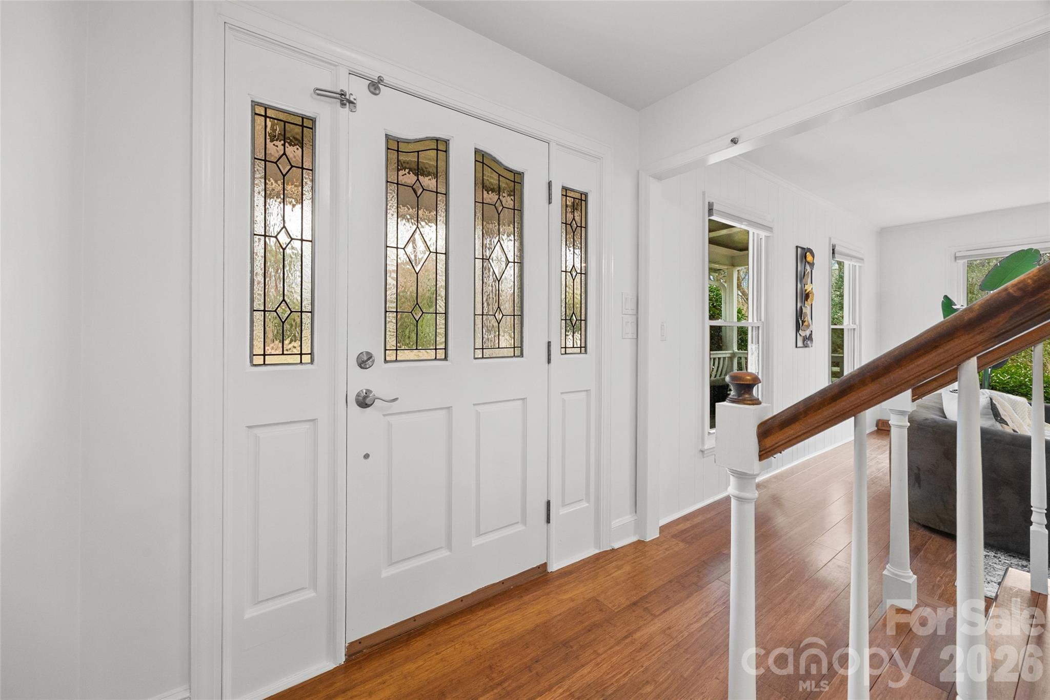 3320 Tilley Morris Road Matthews, NC 28105 - Photo 4 of 48 a view of entryway with wooden floor and stairs