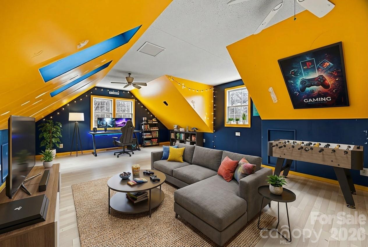 3320 Tilley Morris Road Matthews, NC 28105 - Photo 44 of 48 a living room with furniture a rug and a wall painting