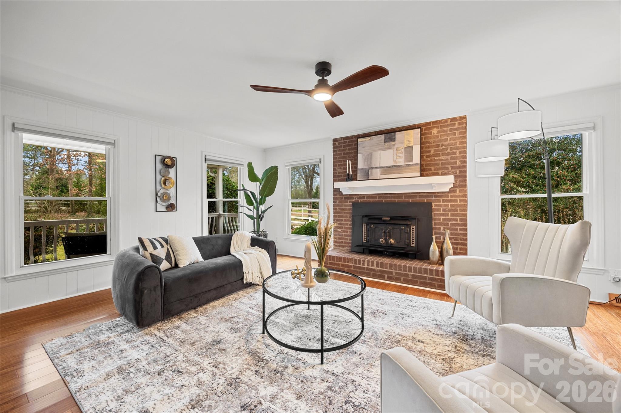 3320 Tilley Morris Road Matthews, NC 28105 - Photo 6 of 48 a living room with furniture a window and a fireplace