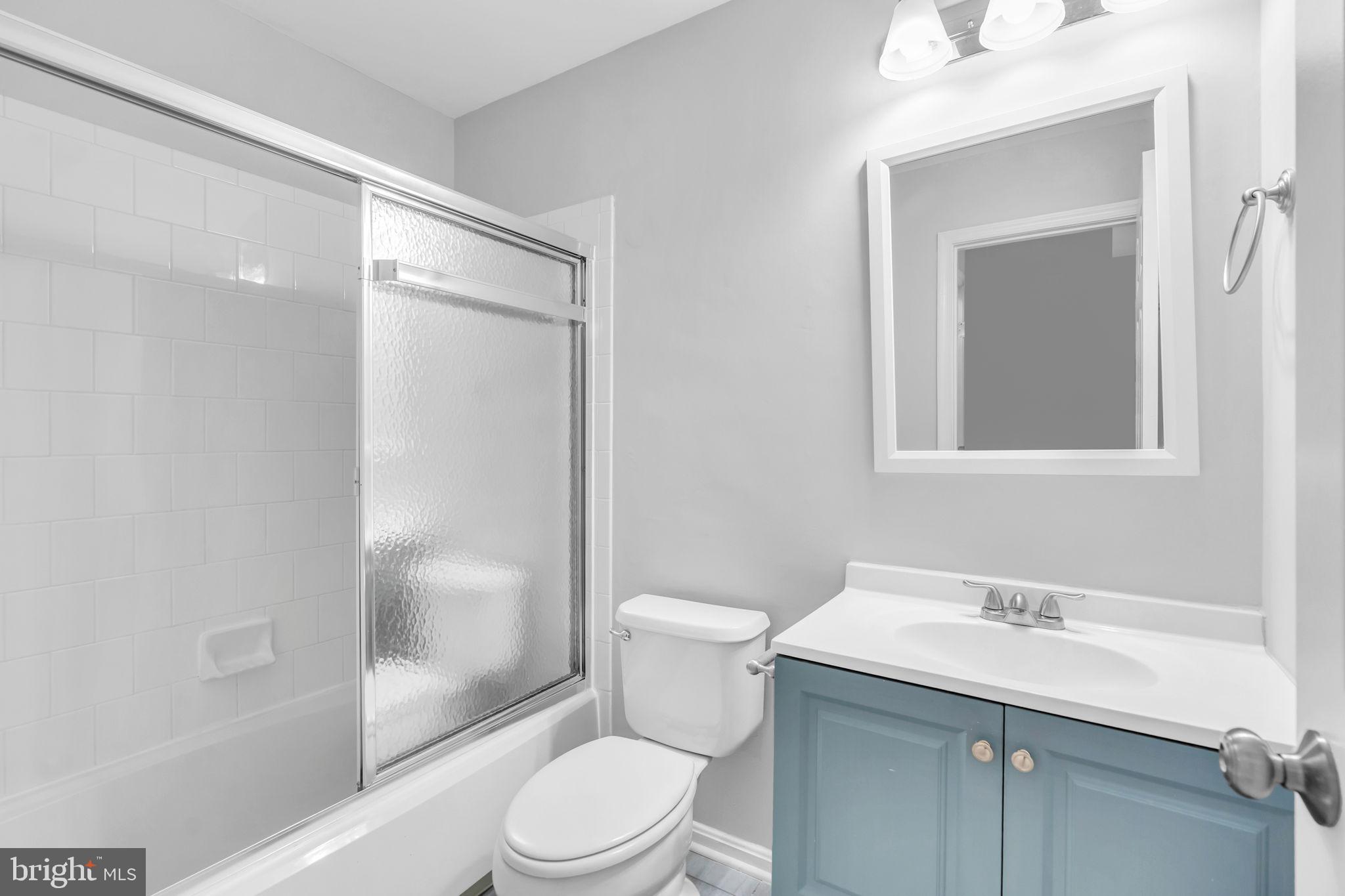 6013 Riddle Walk Alexandria, VA 22312 - Photo 21 of 31 a bathroom with a sink toilet and shower