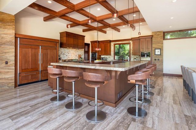 a kitchen with lots of counter top space and a sink