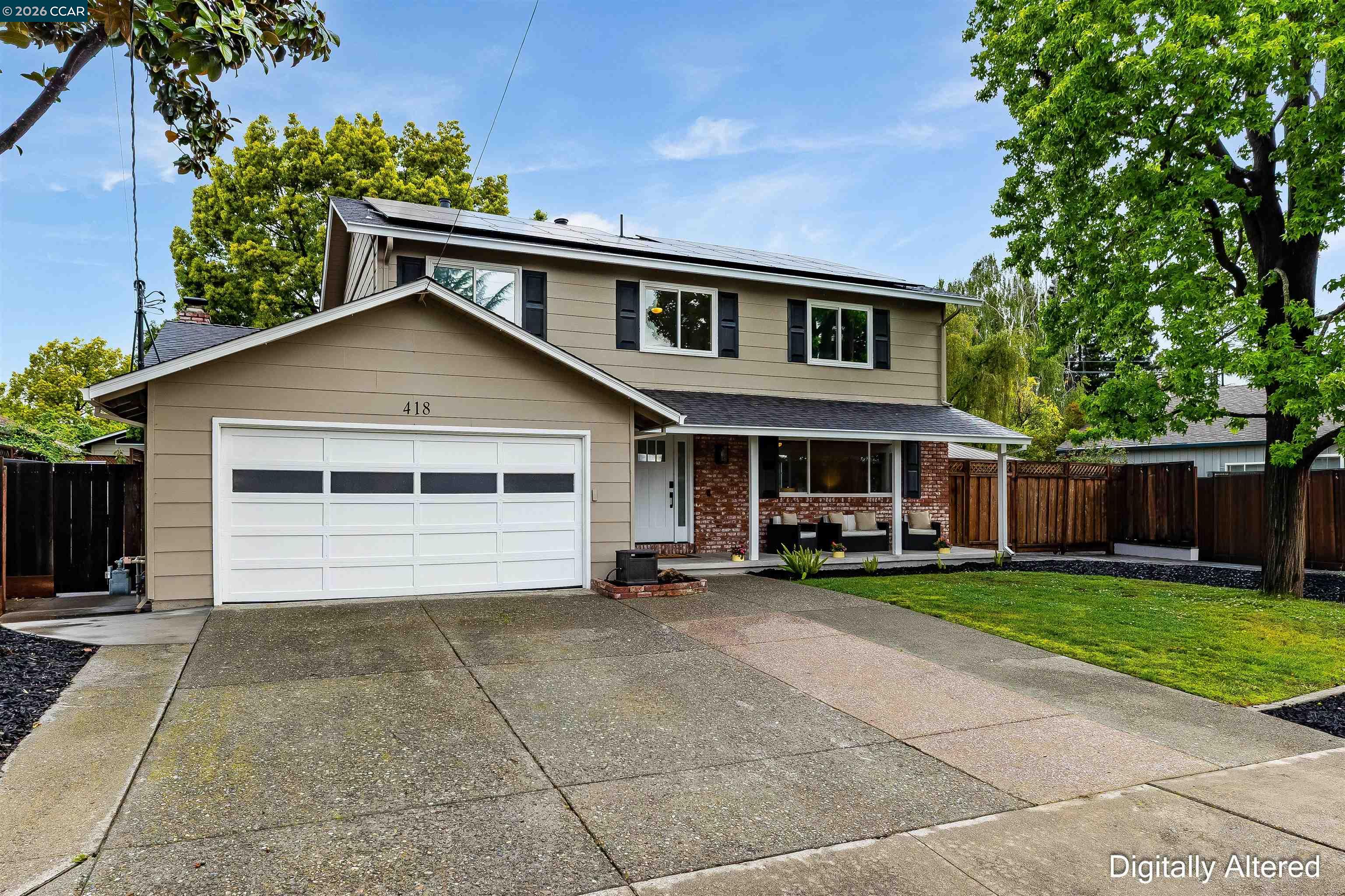 418 Devon Court San Ramon, CA 94583 - Photo 4 of 62 a front view of a house with a yard and garage