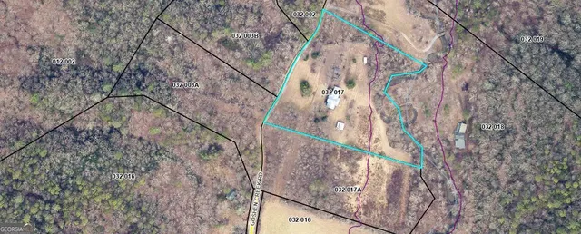 a view of a kitchen with a sink and cabinets