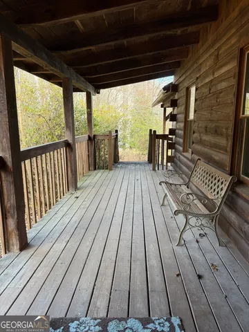 a kitchen with a wooden floor and a refrigerator