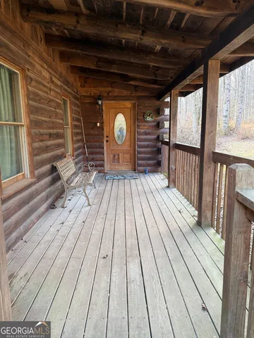 a kitchen with stainless steel appliances kitchen island granite countertop furniture and a refrigerator