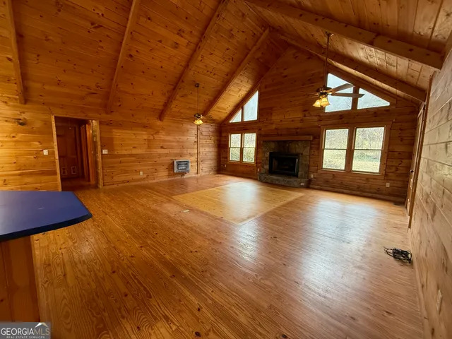 a kitchen with stainless steel appliances granite countertop a stove a sink dishwasher and a microwave oven with cabinets