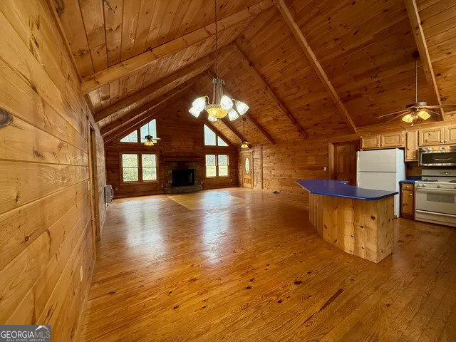a bathroom with a double vanity sink toilet and shower