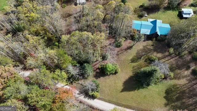 a view of a park with iron fence