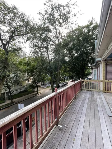 a view of deck with wooden floor and fence