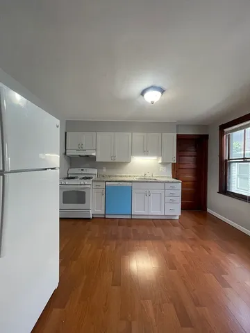 a view of a kitchen with a sink and dishwasher