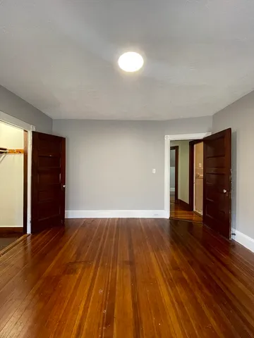 a bathroom with a sink a large mirror and a bathtub