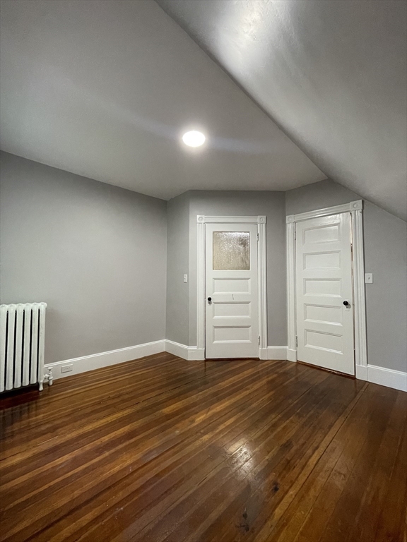 71 Mayfield Street, Unit 2 Boston, MA 02125 - Photo 26 of 33 a view of an empty room with wooden floor