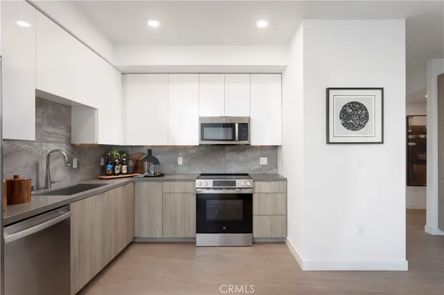 a kitchen with a stove and a microwave