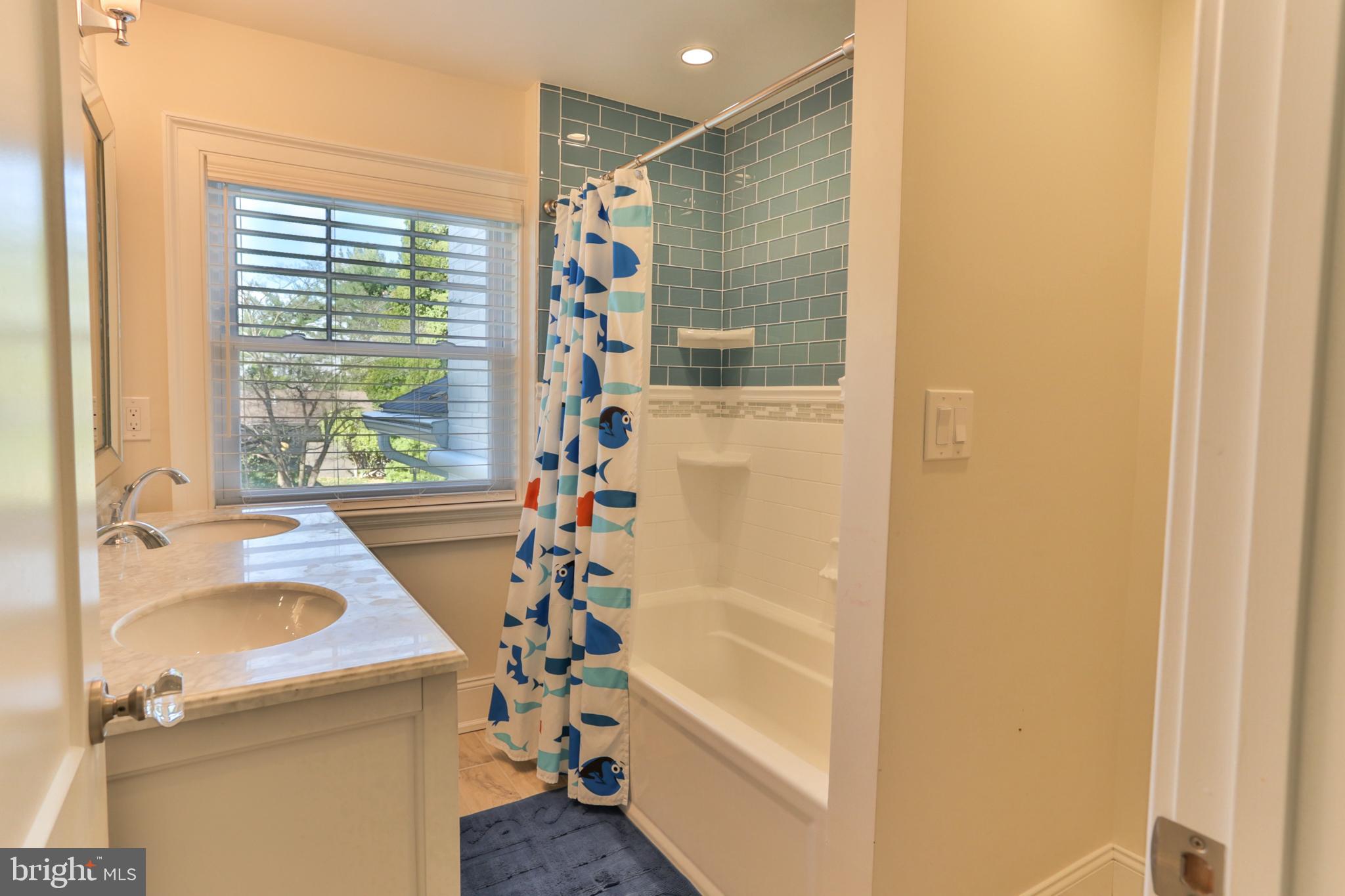 700 Panorama Road Villanova, PA 19085 - Photo 20 of 34 a bathroom with a tub sink and window