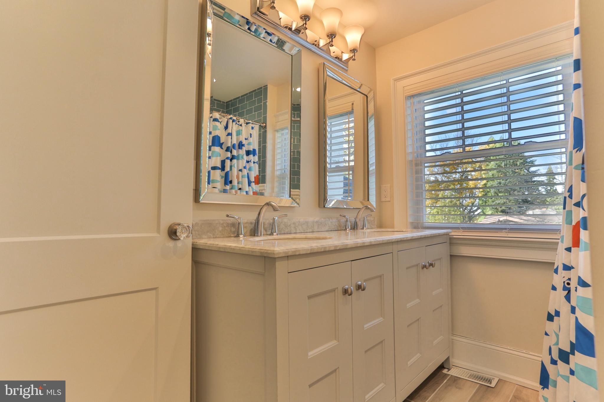 700 Panorama Road Villanova, PA 19085 - Photo 21 of 34 a bathroom with a sink and a mirror