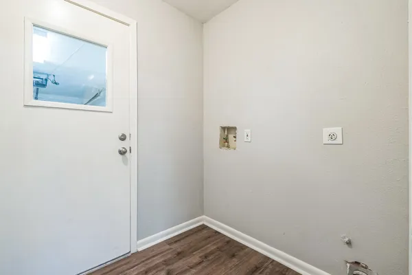 a view of a small space with wooden floor
