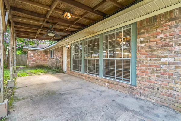 a view of empty room with windows