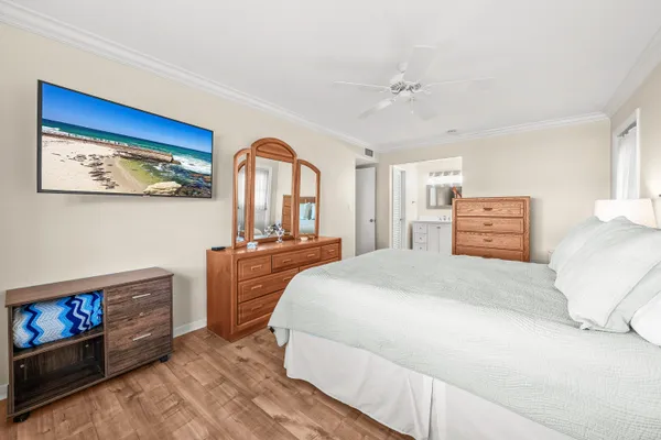 a bedroom with a bed and a dresser