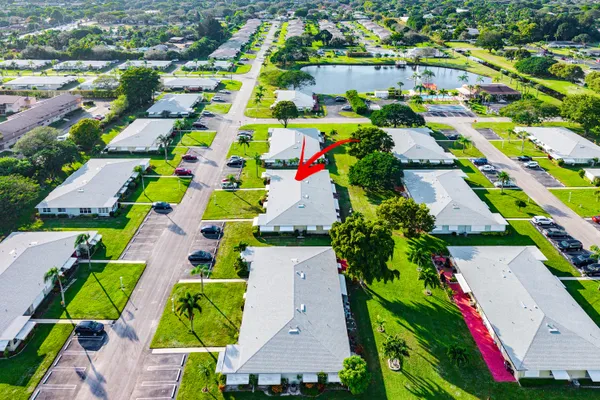 an aerial view of house with yard