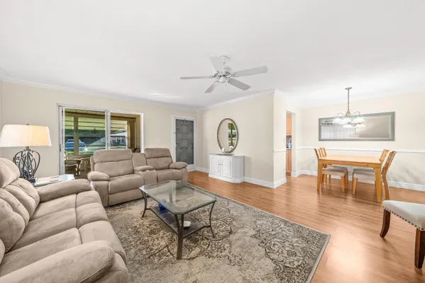 a living room with furniture and a table