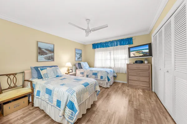 a bedroom with bed and window