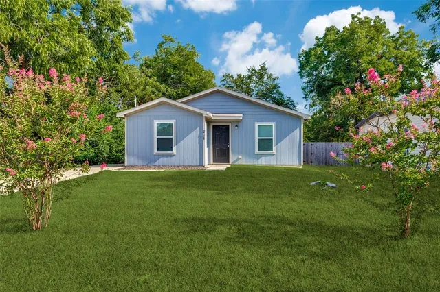 a house view with a garden space