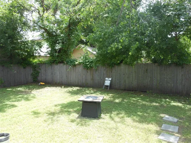 a backyard of a house with green landscape