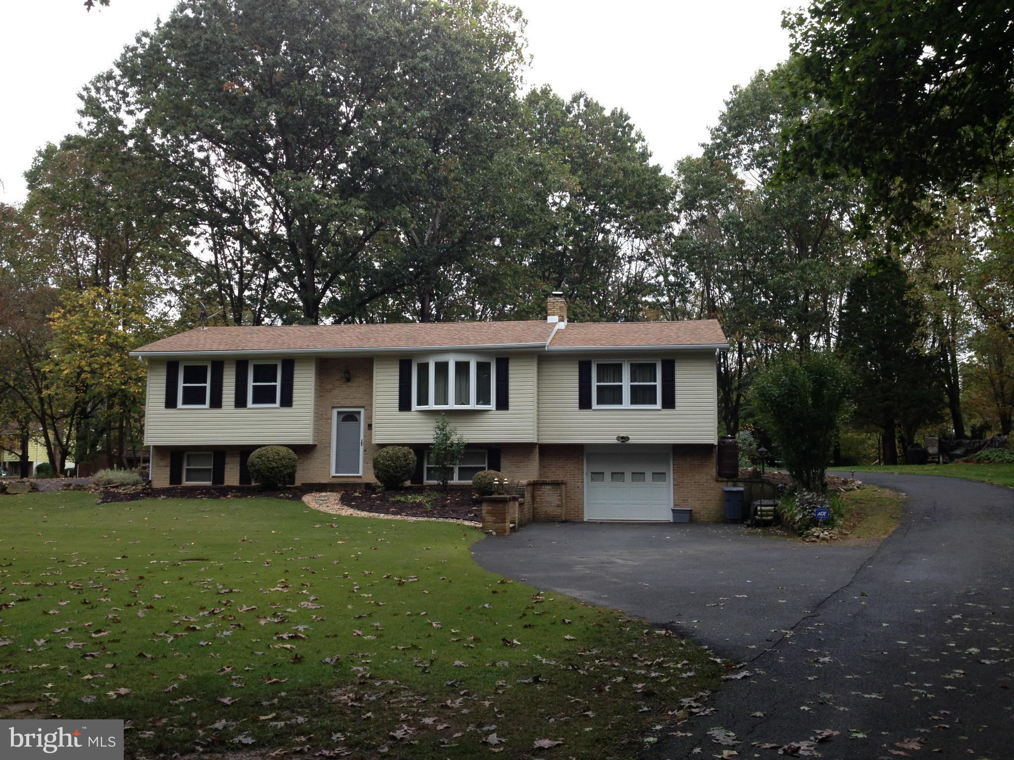 562 Lockhouse Road Falling Waters, WV 25419 - Photo 1 of 29 a front view of a house with a yard porch and outdoor seating