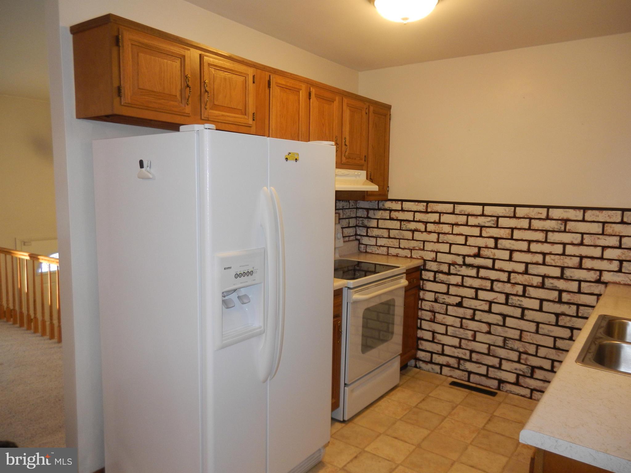 562 Lockhouse Road Falling Waters, WV 25419 - Photo 11 of 29 a refrigerator freezer sitting inside of a kitchen