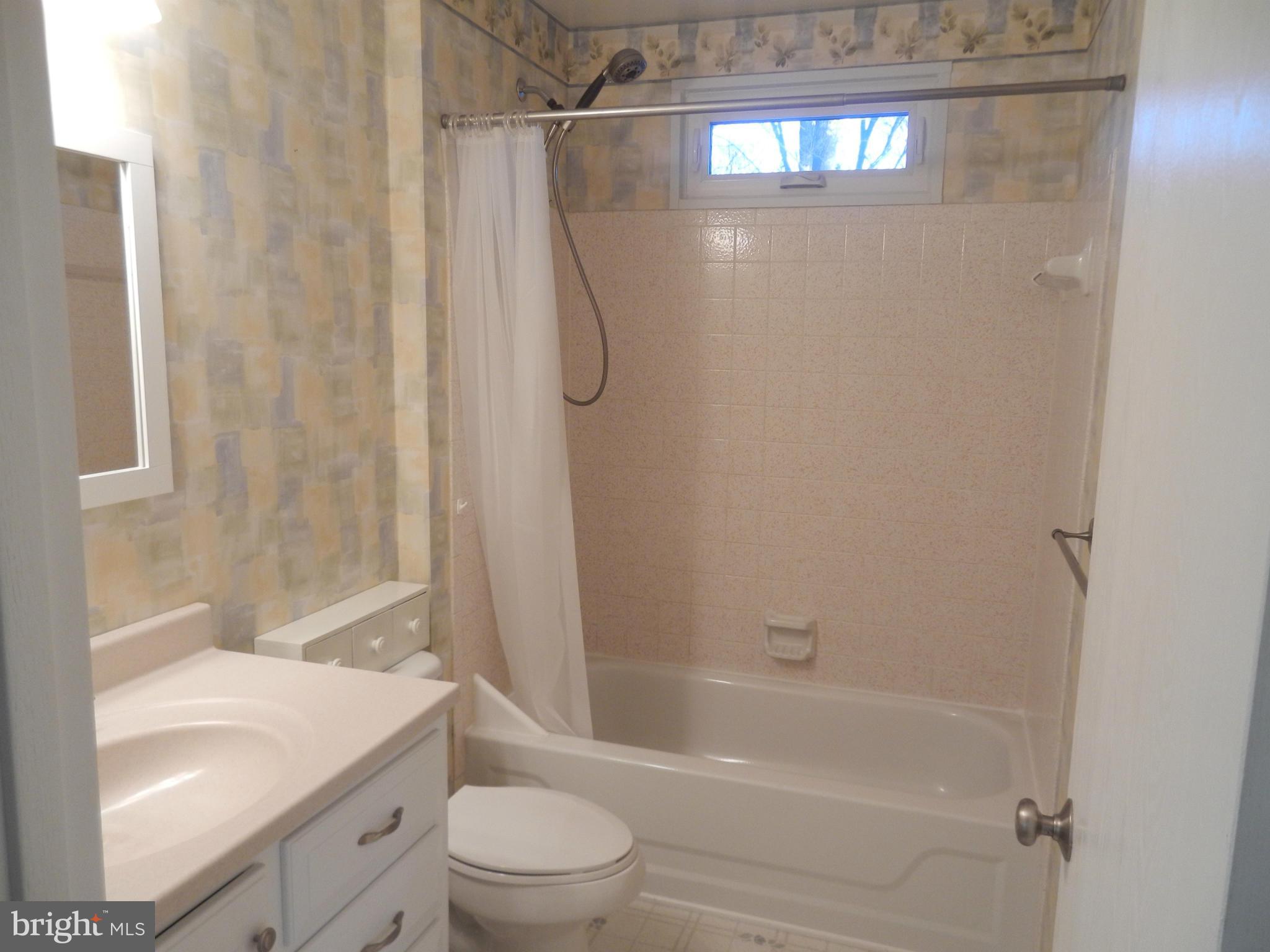 562 Lockhouse Road Falling Waters, WV 25419 - Photo 18 of 29 a bathroom with a granite countertop bathtub shower sink vanity and toilet