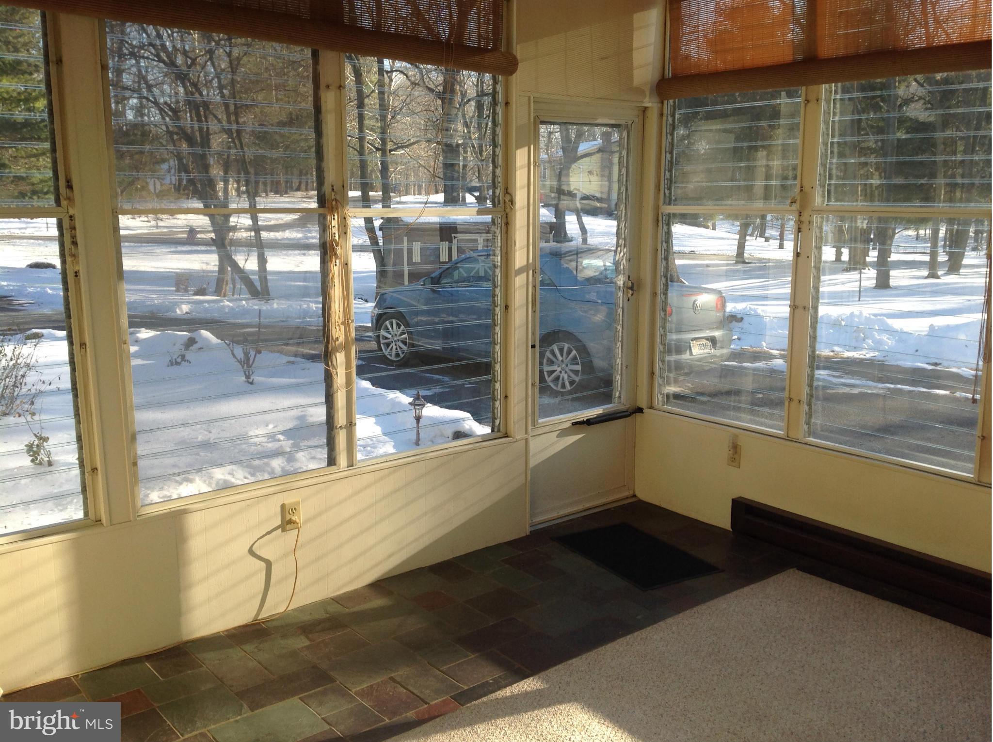 562 Lockhouse Road Falling Waters, WV 25419 - Photo 29 of 29 a view of a glass door with a glass door and a porch