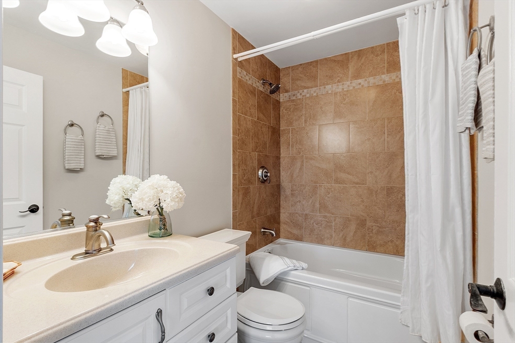20 Central Street, Unit 402 Salem, MA 01970 - Photo 19 of 36 a bathroom with a sink toilet tub and shower