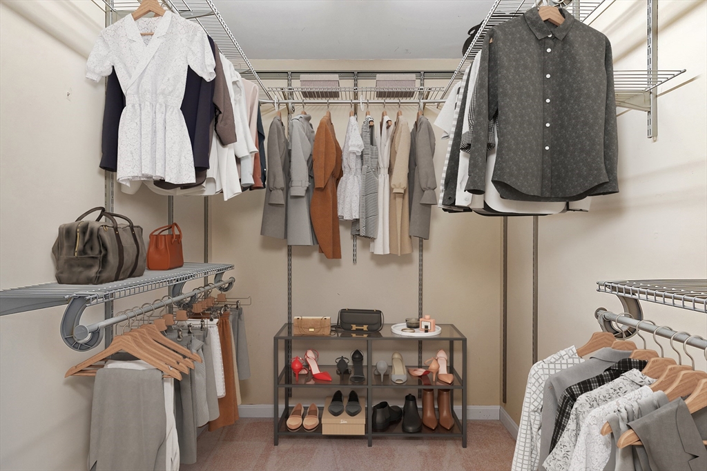 20 Central Street, Unit 402 Salem, MA 01970 - Photo 20 of 36 a view of walk in closet with clothes and shoes