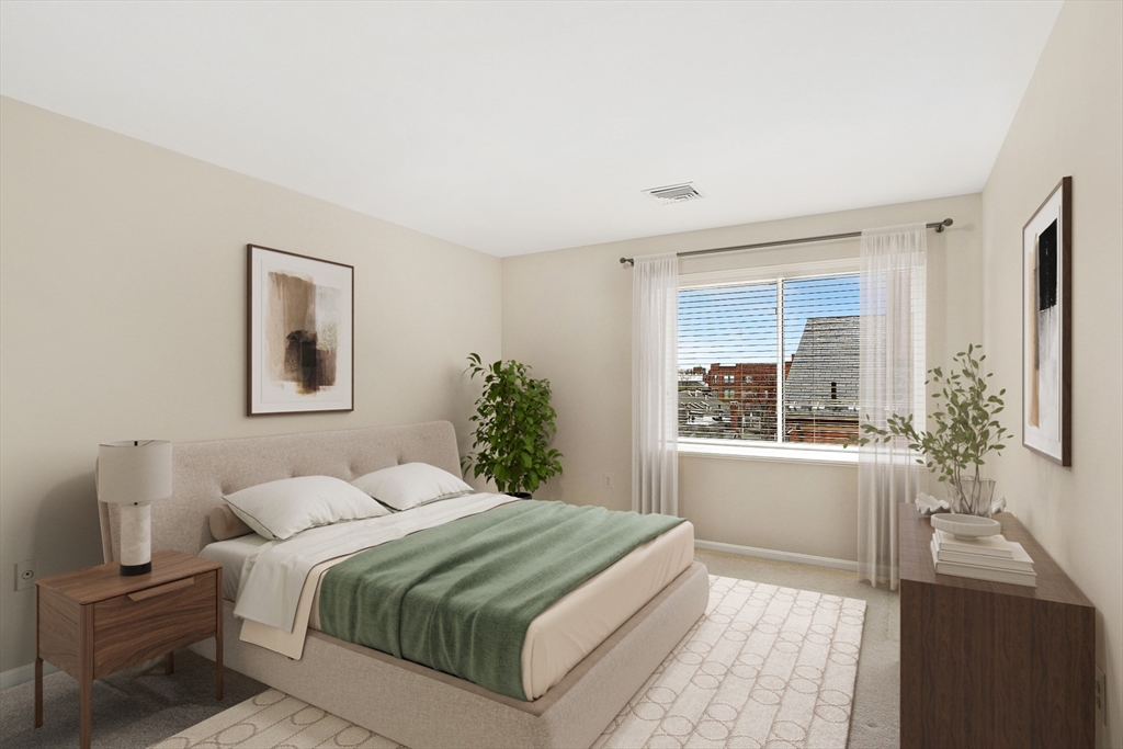 20 Central Street, Unit 402 Salem, MA 01970 - Photo 21 of 36 a bedroom with a large bed and a window