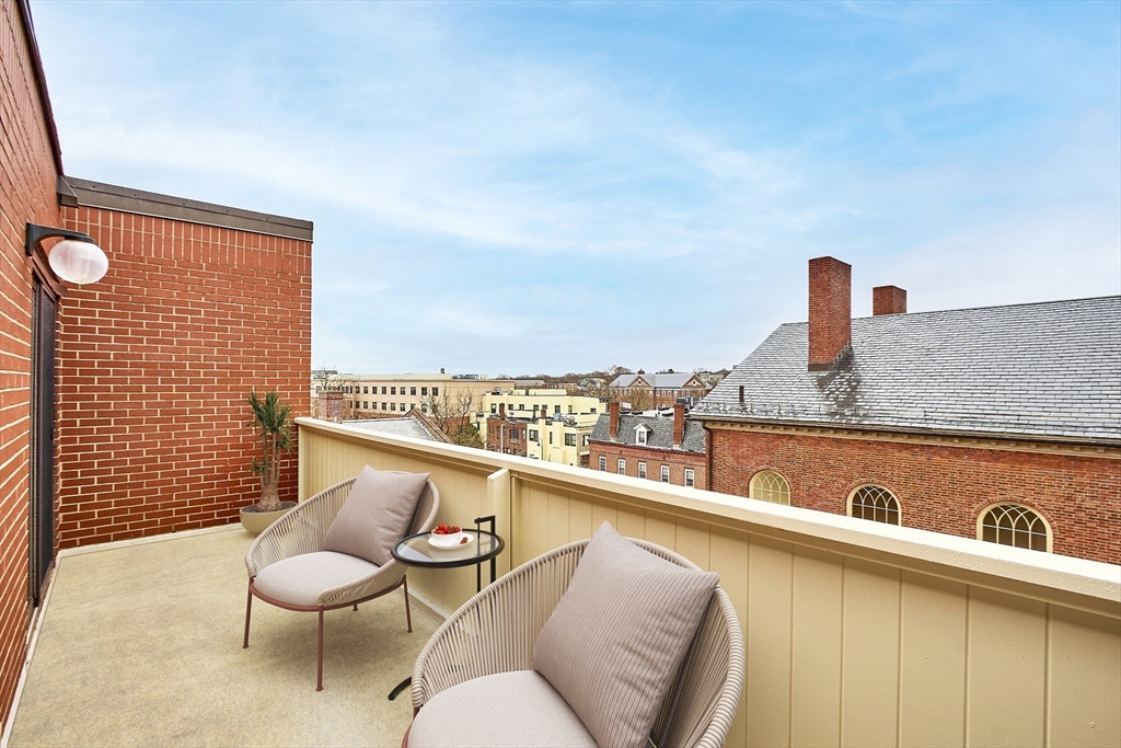 20 Central Street, Unit 402 Salem, MA 01970 - Photo 26 of 36 a terrace with outdoor seating and city view