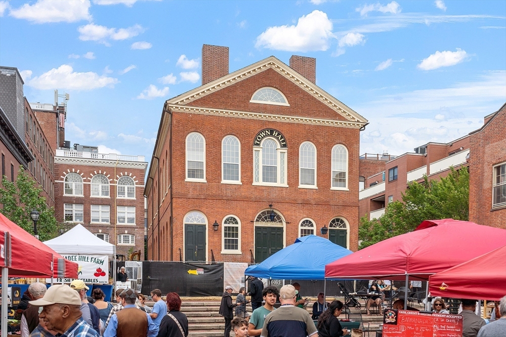 20 Central Street, Unit 402 Salem, MA 01970 - Photo 32 of 36 a front view of a building with street
