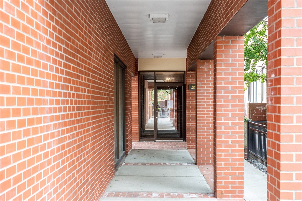 20 Central Street, Unit 402 Salem, MA 01970 - Photo 5 of 36 a view of a brick house with a door and wooden floor