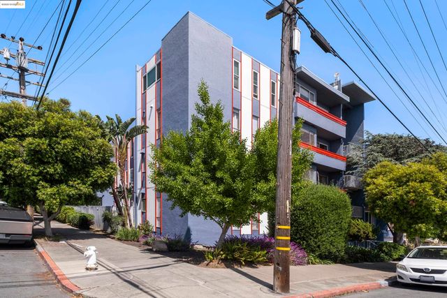 a street sign on a street next to a building