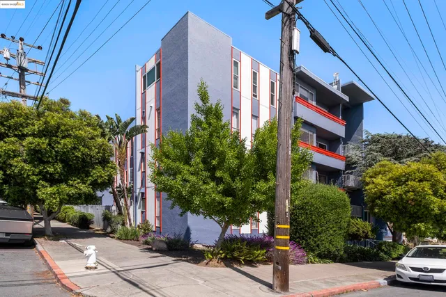a street sign on a street next to a building