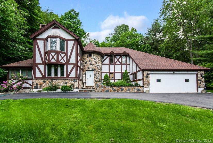 198 Strobel Road Trumbull, CT 06611 - Photo 1 of 1 a front view of a house with a garden and yard