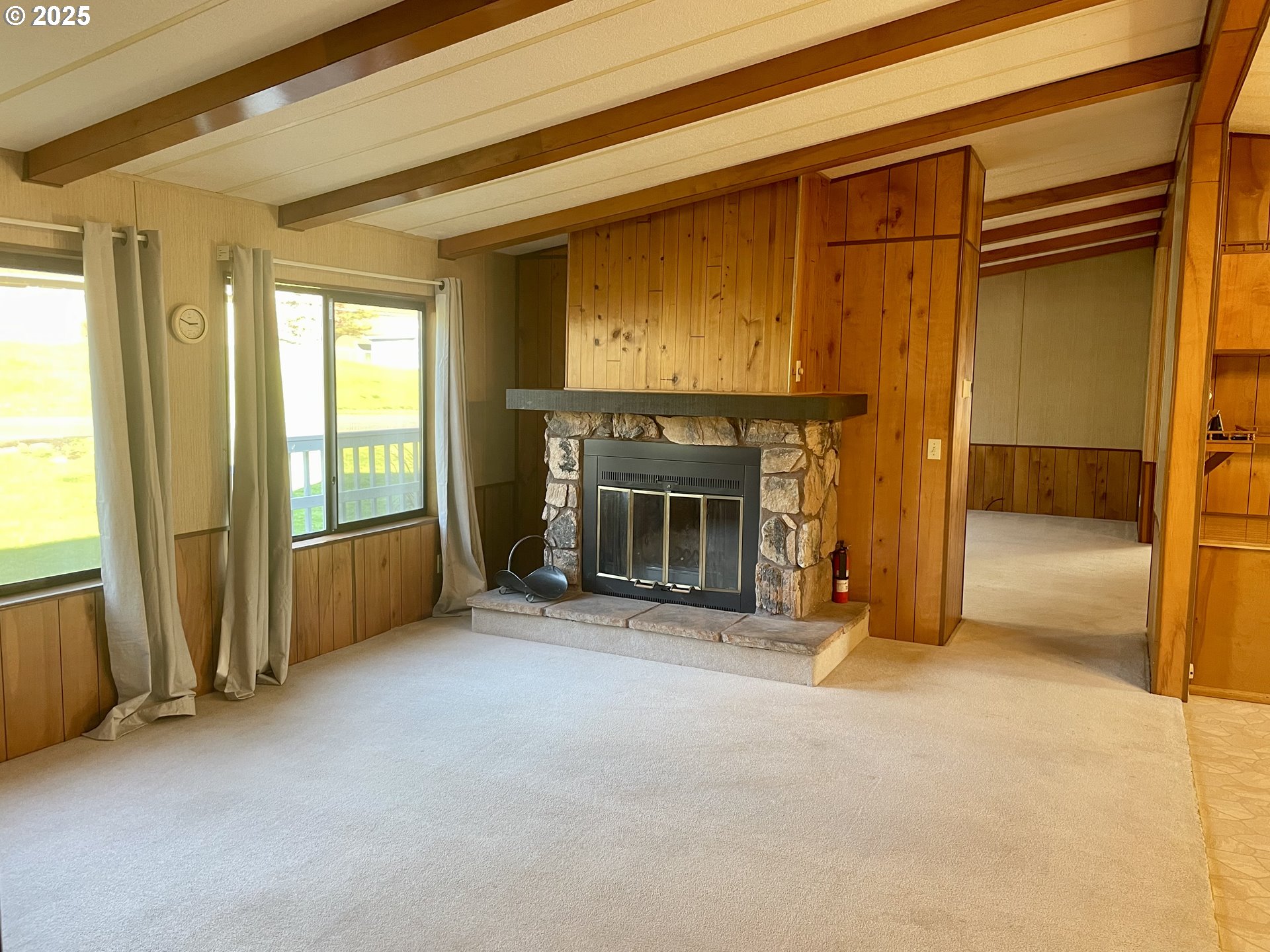 2895 Harris Street Road Kelso, WA 98626 - Photo 16 of 47 an empty room with fireplace and windows