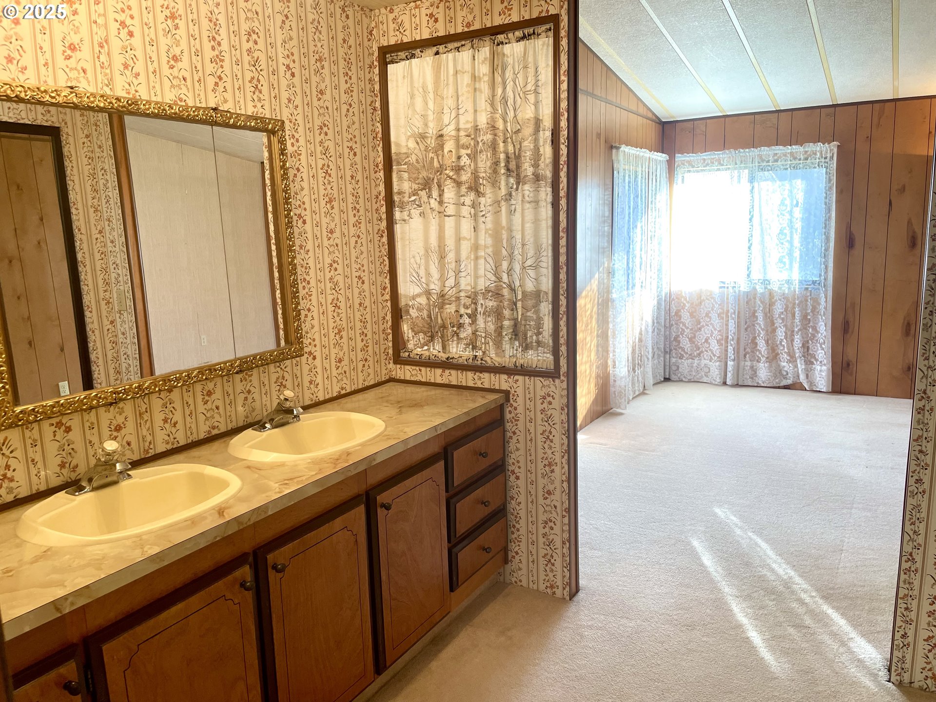 2895 Harris Street Road Kelso, WA 98626 - Photo 22 of 47 a spacious bathroom with a granite countertop sink and a mirror