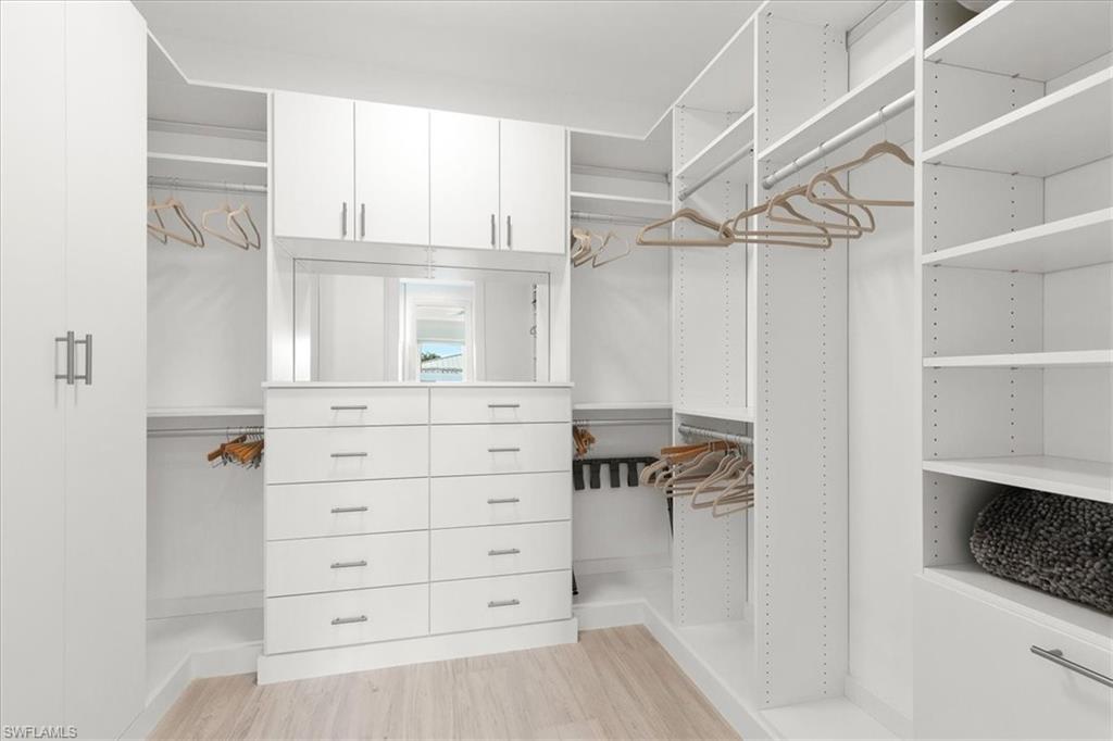 734 109th Avenue North Naples, FL 34108 - Photo 12 of 34 a view of a closet with cabinets