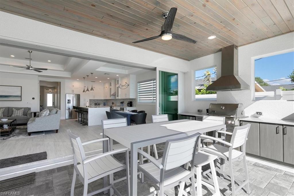 734 109th Avenue North Naples, FL 34108 - Photo 26 of 34 a view of a dining room with furniture